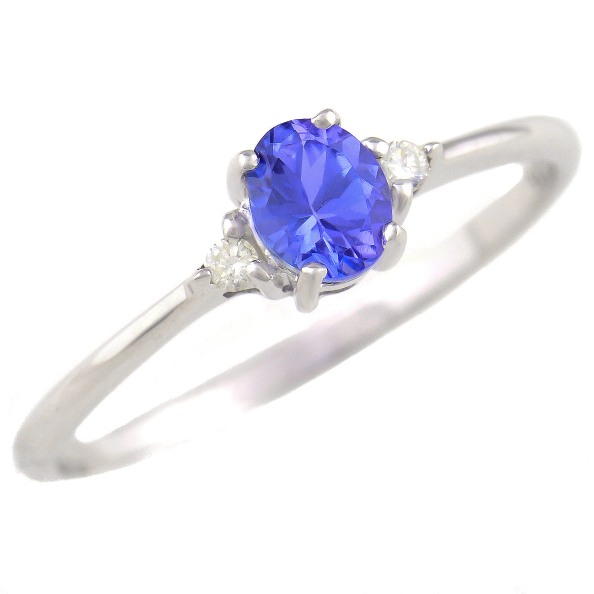 9K SOLID WHITE GOLD 0.30CT NATURAL OVAL TANZANITE RING WITH 2 DIAMONDS.