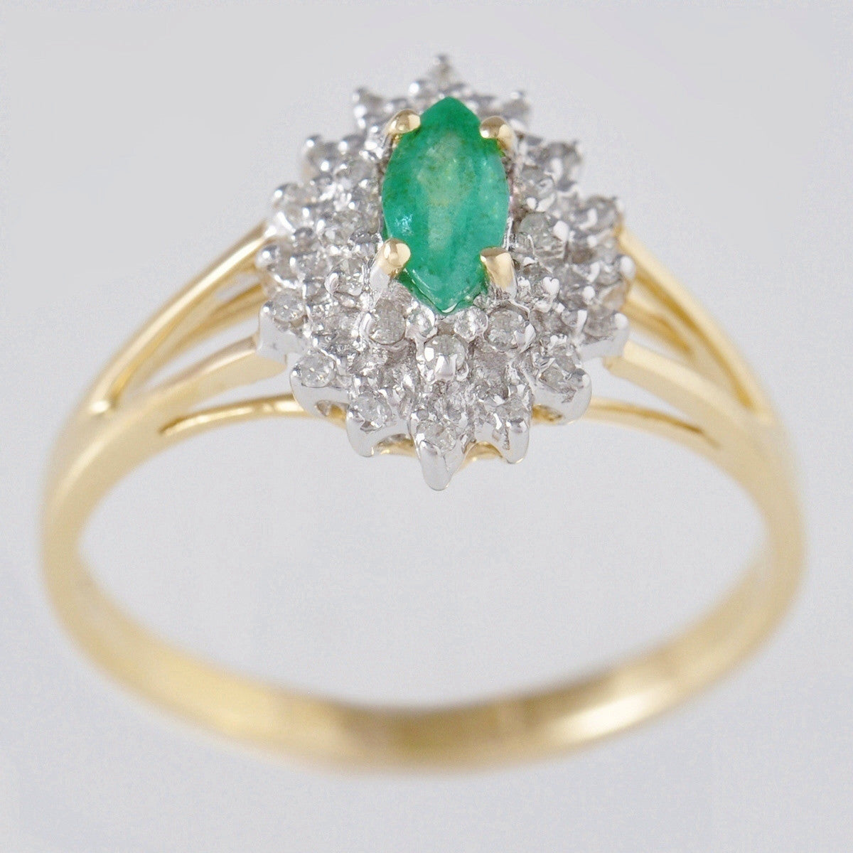 9K SOLID GOLD VINTAGE INSPIRED 0.25CT MARQUISE EMERALD RING WITH 28 DIAMONDS.
