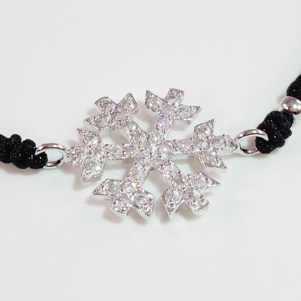 925 STERLING SILVER CZ CRYSTAL SNOWFLAKE ON THREADED BRAIDED BRACELET.