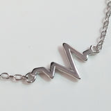 925 STERLING SILVER BRACELET WITH EKG HEARTBEAT CHARM.