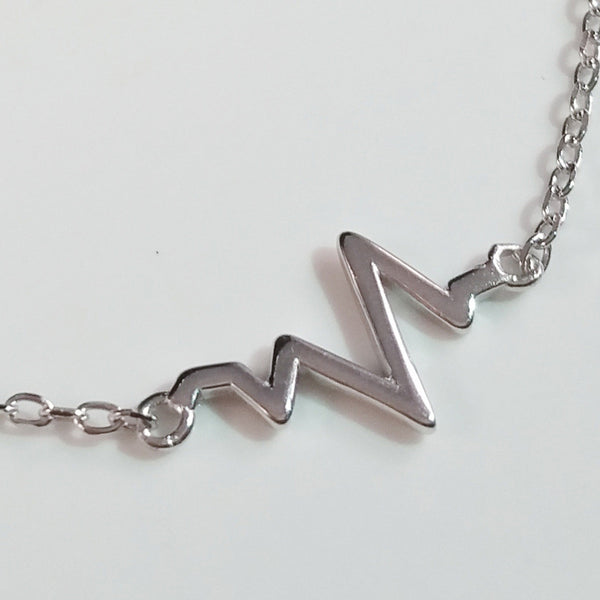 925 STERLING SILVER BRACELET WITH EKG HEARTBEAT CHARM.