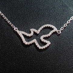 925 STERLING SILVER NECKLACE WITH DOVE PENDANT SET IN SPARKLING CRYSTALS.