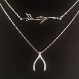 925 STERLING SILVER DOUBLE LAYER NECKLACE WITH CRYSTAL WISHBONE AND TREE BRANCH PENDANT.