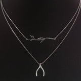 925 STERLING SILVER DOUBLE LAYER NECKLACE WITH CRYSTAL WISHBONE AND TREE BRANCH PENDANT.