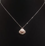 925 STERLING SILVER NECKLACE WITH GENUINE FRESHWATER PEARL SET IN SEA SHELL PENDANT.