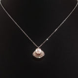 925 STERLING SILVER NECKLACE WITH GENUINE FRESHWATER PEARL SET IN SEA SHELL PENDANT.