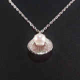 925 STERLING SILVER NECKLACE WITH GENUINE FRESHWATER PEARL SET IN SEA SHELL PENDANT.