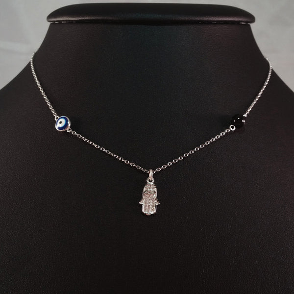 925 STERLING SILVER NECKLACE WITH TURKISH EVIL EYE CHARM AND HAMSA HAND PENDANT SET IN SPARKLING CRYSTALS.