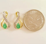 9K SOLID GOLD 0.40CT NATURAL EMERALD STUD EARRINGS WITH FOUR DIAMONDS.