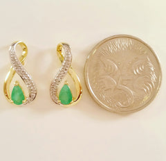 9K SOLID GOLD 0.40CT NATURAL EMERALD STUD EARRINGS WITH FOUR DIAMONDS.
