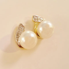 9K SOLID GOLD 7.00MM FRESHWATER PEARL AND DIAMOND EARRINGS.