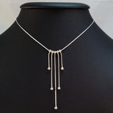 925 STERLING SILVER NECKLACE WITH FIVE FLOATING DROPS.