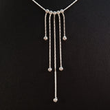 925 STERLING SILVER NECKLACE WITH FIVE FLOATING DROPS.