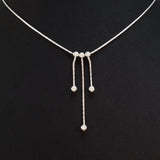 925 STERLING SILVER NECKLACE WITH THREE FLOATING DROPS.