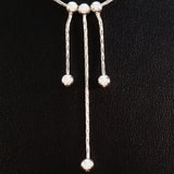 925 STERLING SILVER NECKLACE WITH THREE FLOATING DROPS.