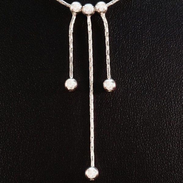 925 STERLING SILVER NECKLACE WITH THREE FLOATING DROPS.
