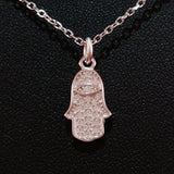 925 STERLING SILVER NECKLACE WITH TURKISH EVIL EYE CHARM AND HAMSA HAND PENDANT SET IN SPARKLING CRYSTALS.