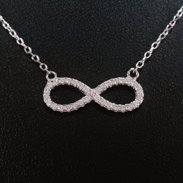 925 STERLING SILVER NECKLACE WITH ETERNITY PENDANT SET IN SPARKLING CRYSTALS.