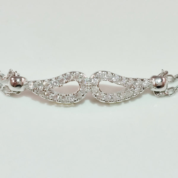 925 STERLING SILVER BRACELET WITH ANGEL WINGS CHARM PAVED WITH  SPARKLING CZ CRYSTALS.