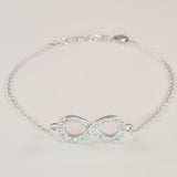 925 STERLING SILVER BRACELET WITH ETERNITY CHARM PAVED WITH  SPARKLING CZ CRYSTALS.