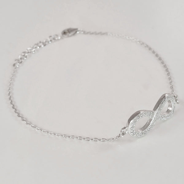 925 STERLING SILVER BRACELET WITH ETERNITY CHARM PAVED WITH  SPARKLING CZ CRYSTALS.