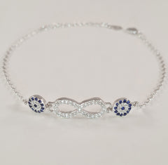 925 STERLING SILVER BRACELET WITH ETERNITY SYMBOL AND DOUBLE EVIL EYE CHARM PAVED WITH  SPARKLING CZ CRYSTALS.