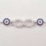 925 STERLING SILVER BRACELET WITH ETERNITY SYMBOL AND DOUBLE EVIL EYE CHARM PAVED WITH  SPARKLING CZ CRYSTALS.