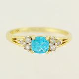 9K SOLID YELLOW GOLD 0.60CT NATURAL BLUE TOPAZ RING WITH 6 DIAMONDS.