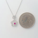9K SOLID WHITE GOLD 45CM NECKLACE WITH NATURAL RUBY AND 25 DIAMOND PENDANT.