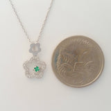 9K SOLID WHITE GOLD 45CM NECKLACE WITH NATURAL EMERALD AND 25 DIAMOND PENDANT.