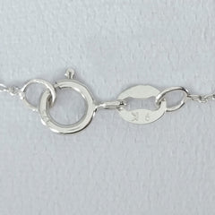 9K SOLID WHITE GOLD 45CM NECKLACE WITH NATURAL RUBY AND 25 DIAMOND PENDANT.