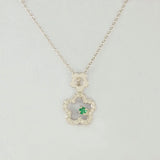 9K SOLID WHITE GOLD 45CM NECKLACE WITH NATURAL EMERALD AND 25 DIAMOND PENDANT.