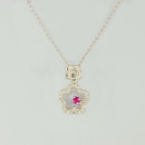 9K SOLID WHITE GOLD 45CM NECKLACE WITH NATURAL RUBY AND 25 DIAMOND PENDANT.