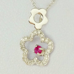 9K SOLID WHITE GOLD 45CM NECKLACE WITH NATURAL RUBY AND 25 DIAMOND PENDANT.