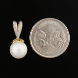 9K SOLID GOLD 8.00MM PEARL AND DIAMOND PENDANT.