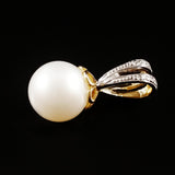 9K SOLID GOLD 8.00MM PEARL AND DIAMOND PENDANT.