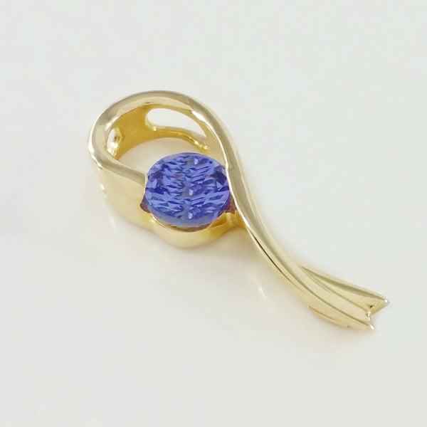 9K SOLID GOLD 0.29CT TANZANITE PENDANT.