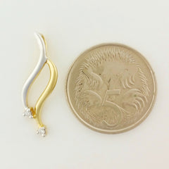 9K SOLID YELLOW AND WHITE GOLD PENDANT WITH TWO DIAMONDS.
