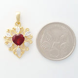 9K SOLID GOLD 0.95CT ALMANDINE GARNET FILIGREE PENDANT WITH 6 DIAMONDS.