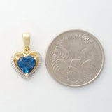 9K SOLID GOLD 1.20CT LONDON BLUE TOPAZ AND DIAMOND PENDANT.