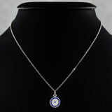 925 STERLING SILVER NECKLACE WITH ROUND EVIL EYE PENDANT SET IN SPARKLING CRYSTALS.