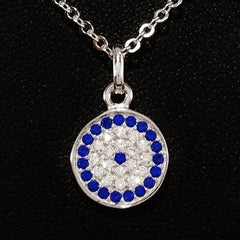925 STERLING SILVER NECKLACE WITH ROUND EVIL EYE PENDANT SET IN SPARKLING CRYSTALS.