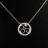 925 STERLING SILVER NECKLACE WITH OM NAMASTE PENDANT SET IN SPARKLING CRYSTALS.