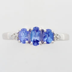 9K SOLID WHITE GOLD 0.60CT NATURAL TANZANITE TRILOGY RING WITH 6 DIAMONDS.