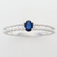 9K SOLID WHITE GOLD 0.25CT NATURAL SAPPHIRE RING WITH BEADED SHOULDERS.