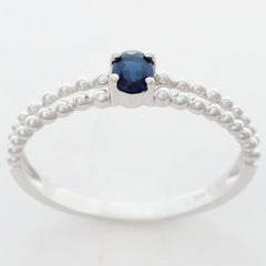 9K SOLID WHITE GOLD 0.25CT NATURAL SAPPHIRE RING WITH BEADED SHOULDERS.