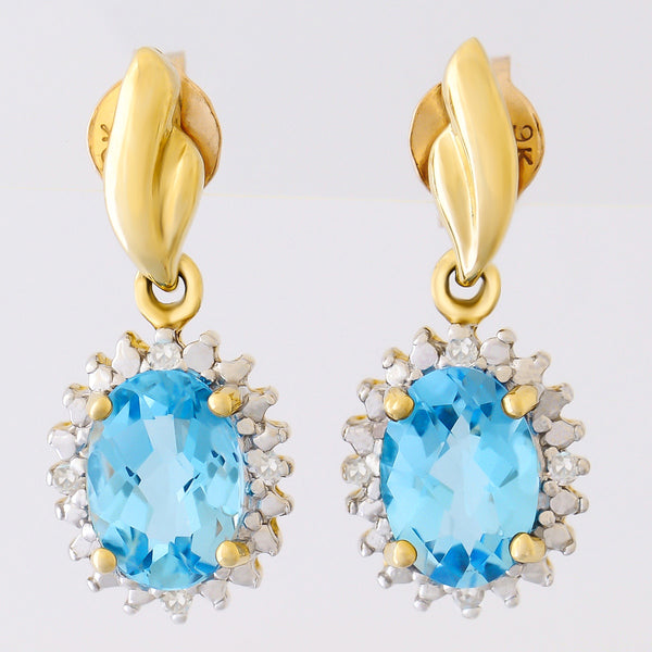 9K SOLID GOLD 1.70CT SWISS BLUE TOPAZ EARRINGS WITH EIGHT DIAMONDS.