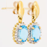 9K SOLID GOLD 1.70CT SWISS BLUE TOPAZ EARRINGS WITH EIGHT DIAMONDS.