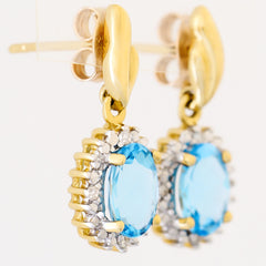 9K SOLID GOLD 1.70CT SWISS BLUE TOPAZ EARRINGS WITH EIGHT DIAMONDS.