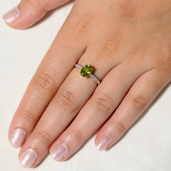 9K SOLID GOLD 1.30 CT NATURAL OVAL PERIDOT RING WITH 10 DIAMONDS.